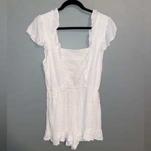 A white shirt sleeve romper size large